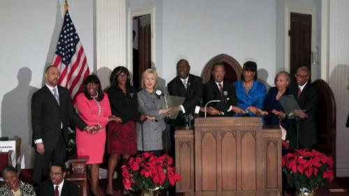 U.S. Democratic presidential candidate Hillary Clinton (4th L) sings "We Shall Overcome" with other speakers at the National Bar Association's 60th Anniversary of the Montgomery Bus Boycott December 1, 2015 in Montgomery, AL. REUTERS/Marvin Gentry