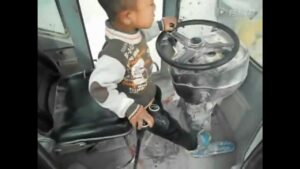 5 Year Old Asian Child Operates Construction Machine